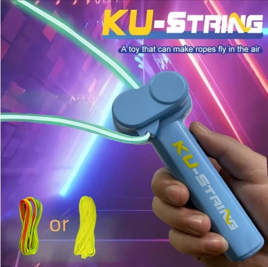 A hand holding a blue KU-STRING toy handle with a neon green rope attached, set against a colorful purple and pink graphic background with text reading 'KU-STRING' and smaller text about the toy making ropes fly in the air.